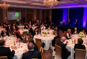 Guests at the Clínica Amistad Gala in formal attire enjoying the event.
