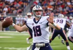 Quarterback Noah Fifita throwing a pass during a game